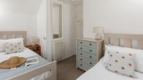 The twin beds are perfect for young adults or children.