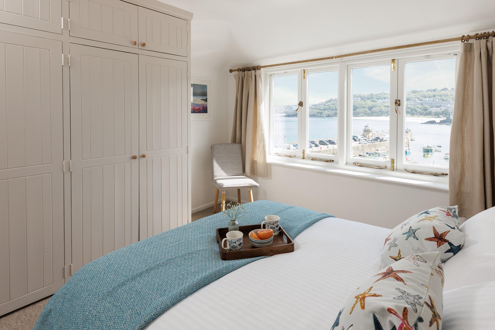 Open the curtains each morning to see the sun shining on the sea.