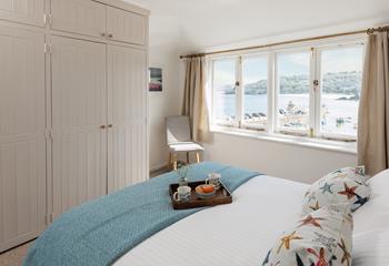 Open the curtains each morning to see the sun shining on the sea.