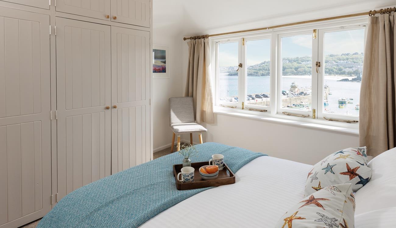 Open the curtains each morning to see the sun shining on the sea.