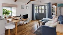 The beautifully decorated living area offers peace and tranquility for a couple. 