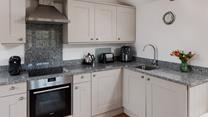 The kitchen is well-equipped for rustling up a delicious meal. 