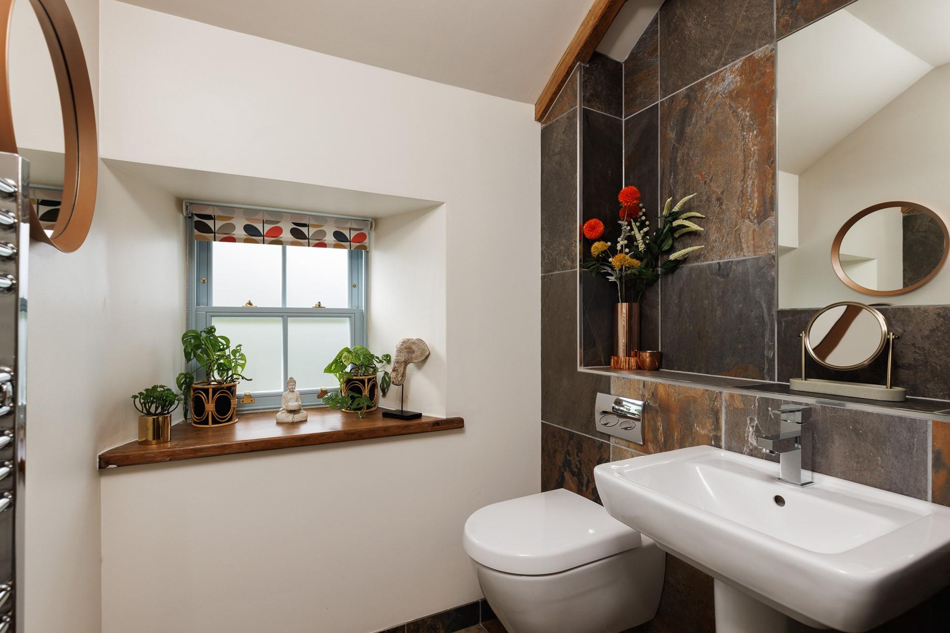 The modern shower room is the perfect place to get ready to start the day. 