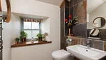 The modern shower room is the perfect place to get ready to start the day. 