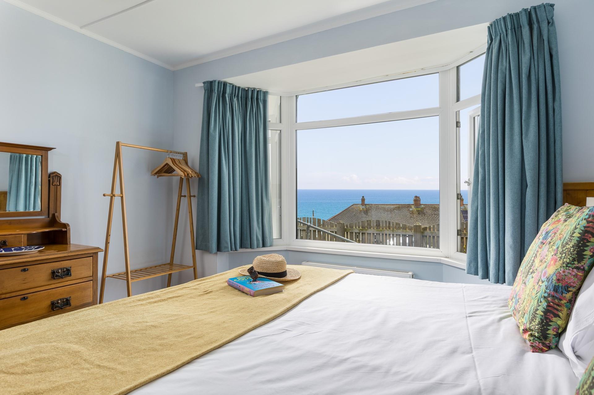 Open the windows in bedroom 1 and let the sea air in!