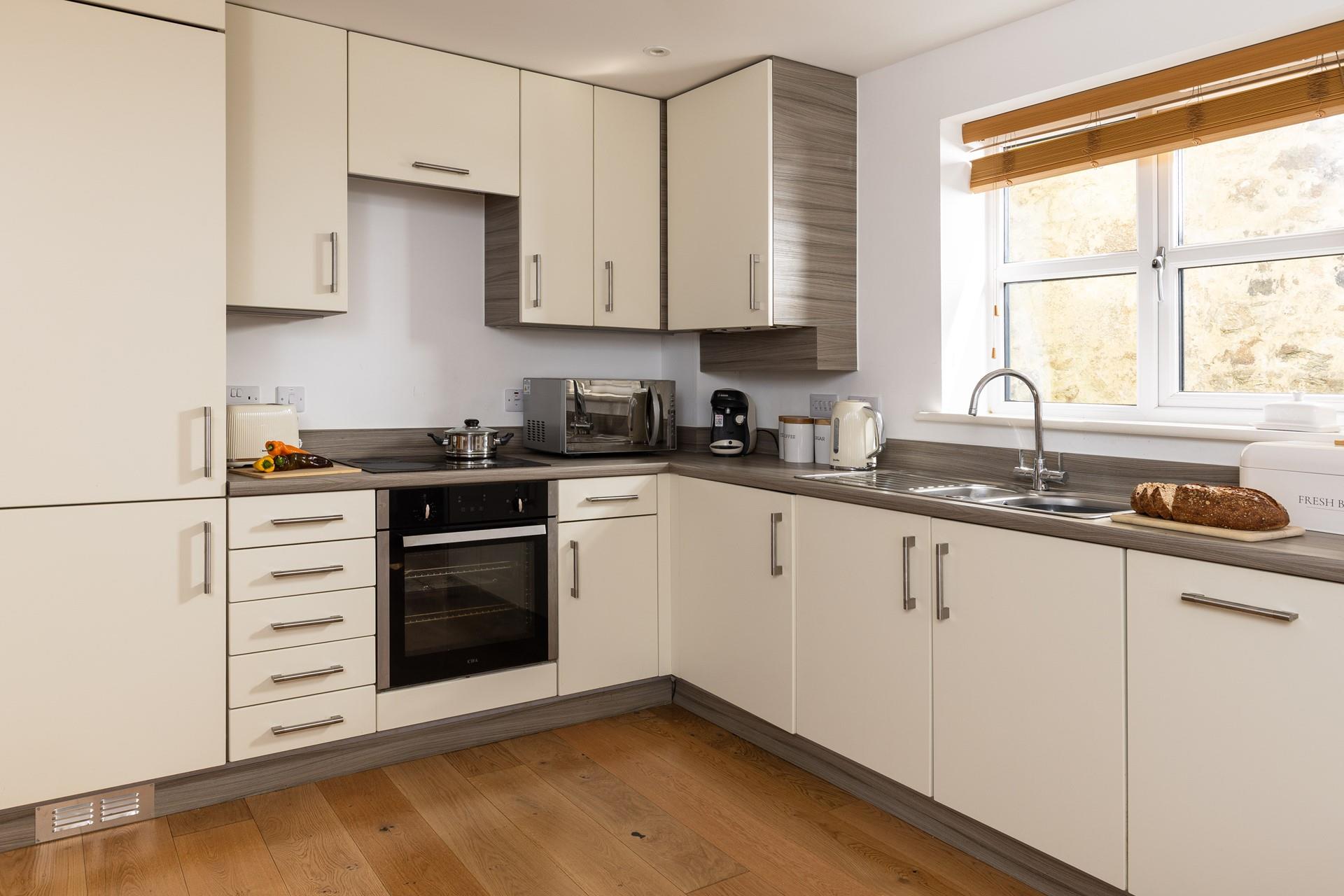 The kitchen is well-equipped with everything you need.