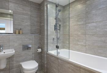 The family bathroom has a shower over bath, just what you need after a busy beach day!
