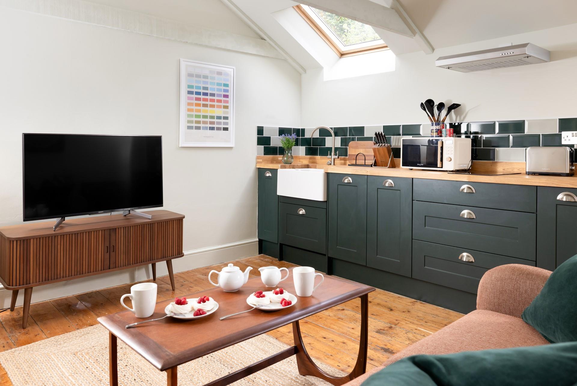 The compact kitchen area is well equipped with all the amenities you need.
