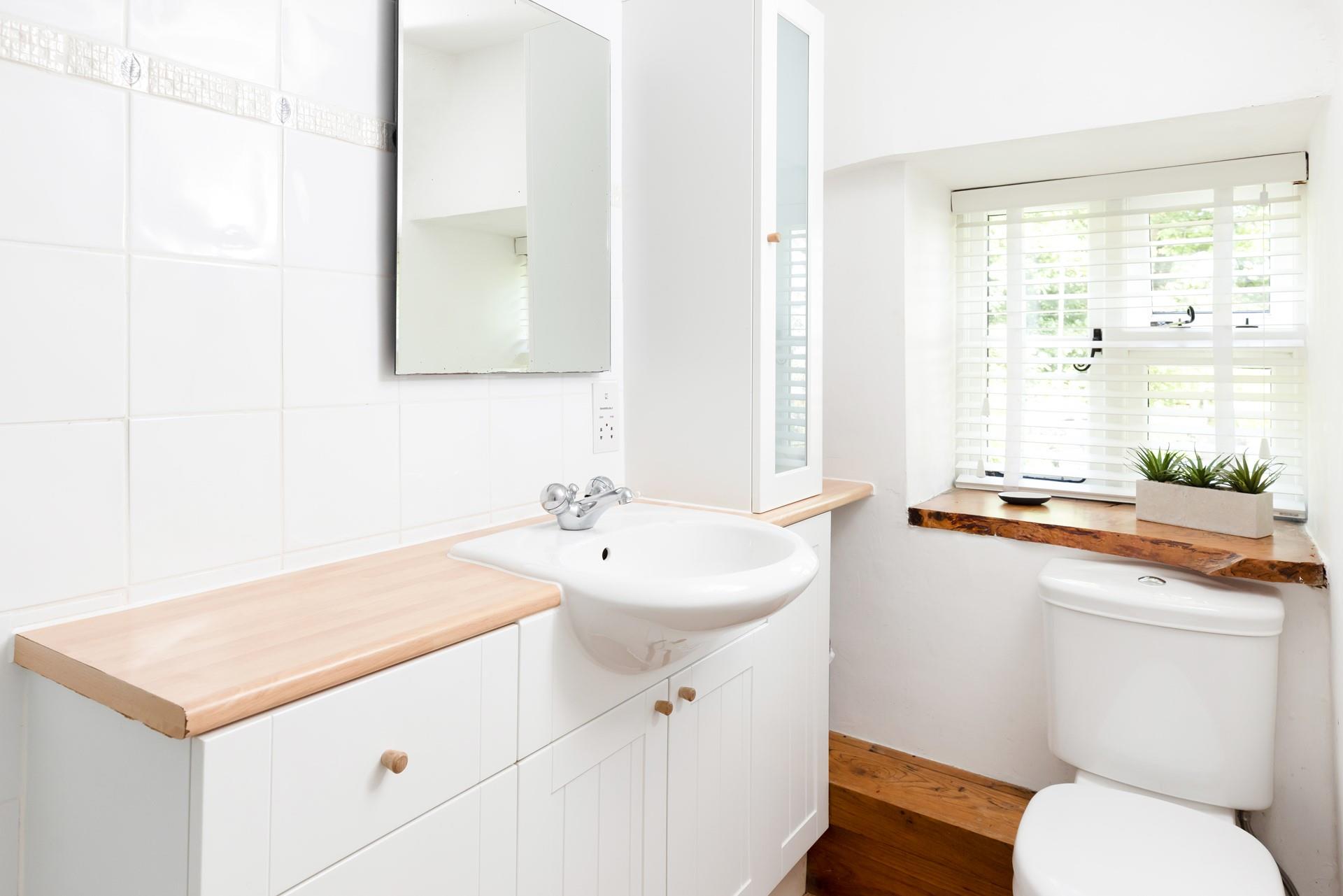 The bright bathroom is the perfect place to get ready for the day!