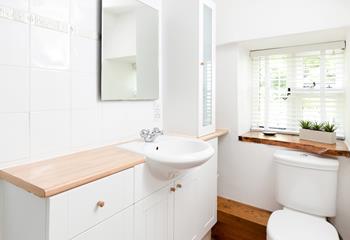 The bright bathroom is the perfect place to get ready for the day!