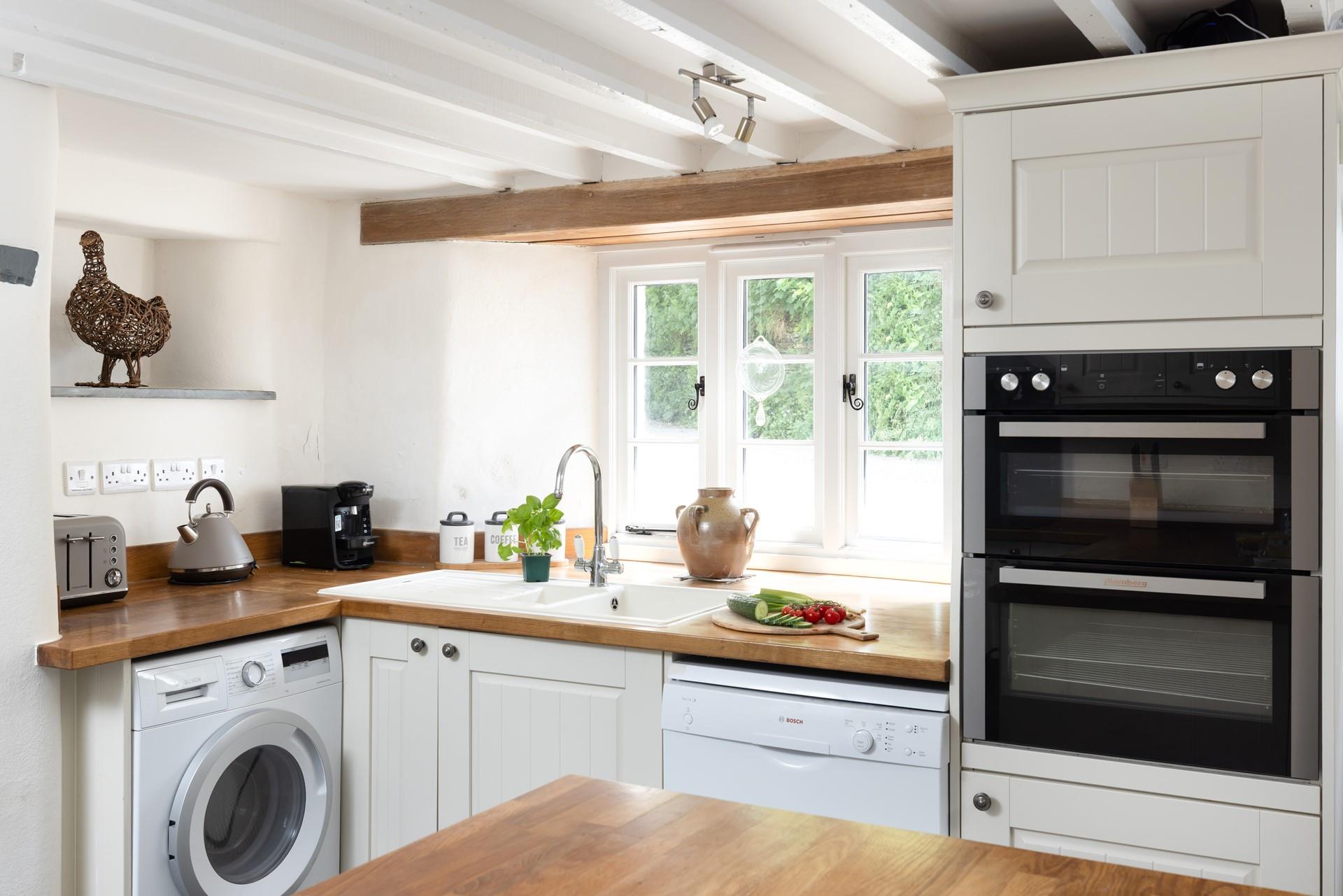 The well-equipped kitchen is the perfect spot to prepare delicious meals. 