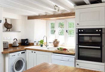 The well-equipped kitchen is the perfect spot to prepare delicious meals. 