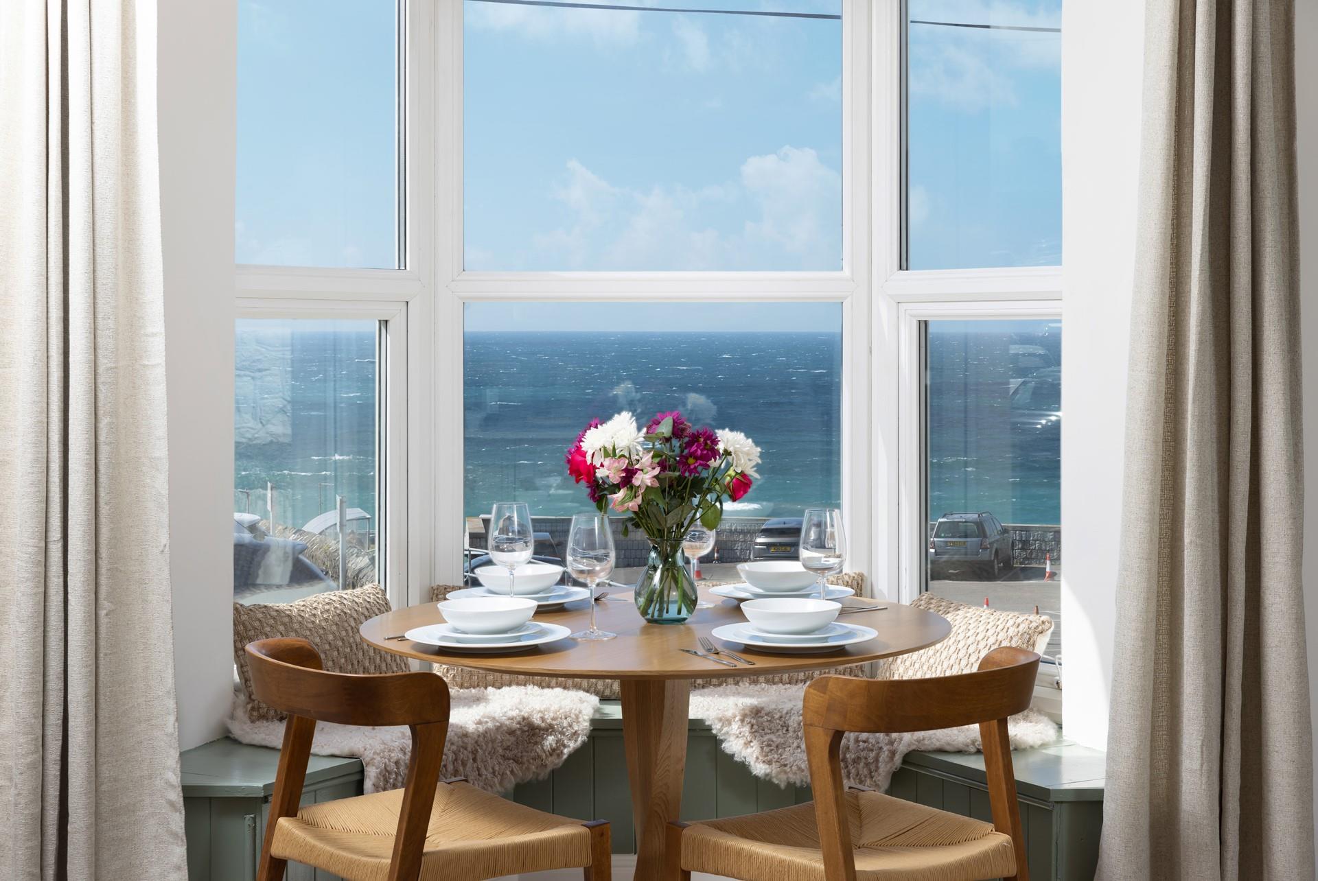 The window seat makes the most of the incredible view, the perfect dining nook!