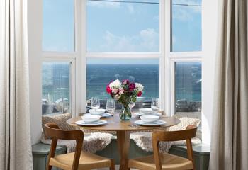 The window seat makes the most of the incredible view, the perfect dining nook!