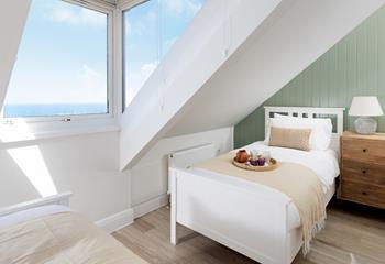 Wake up to sea views from the twin bedroom!