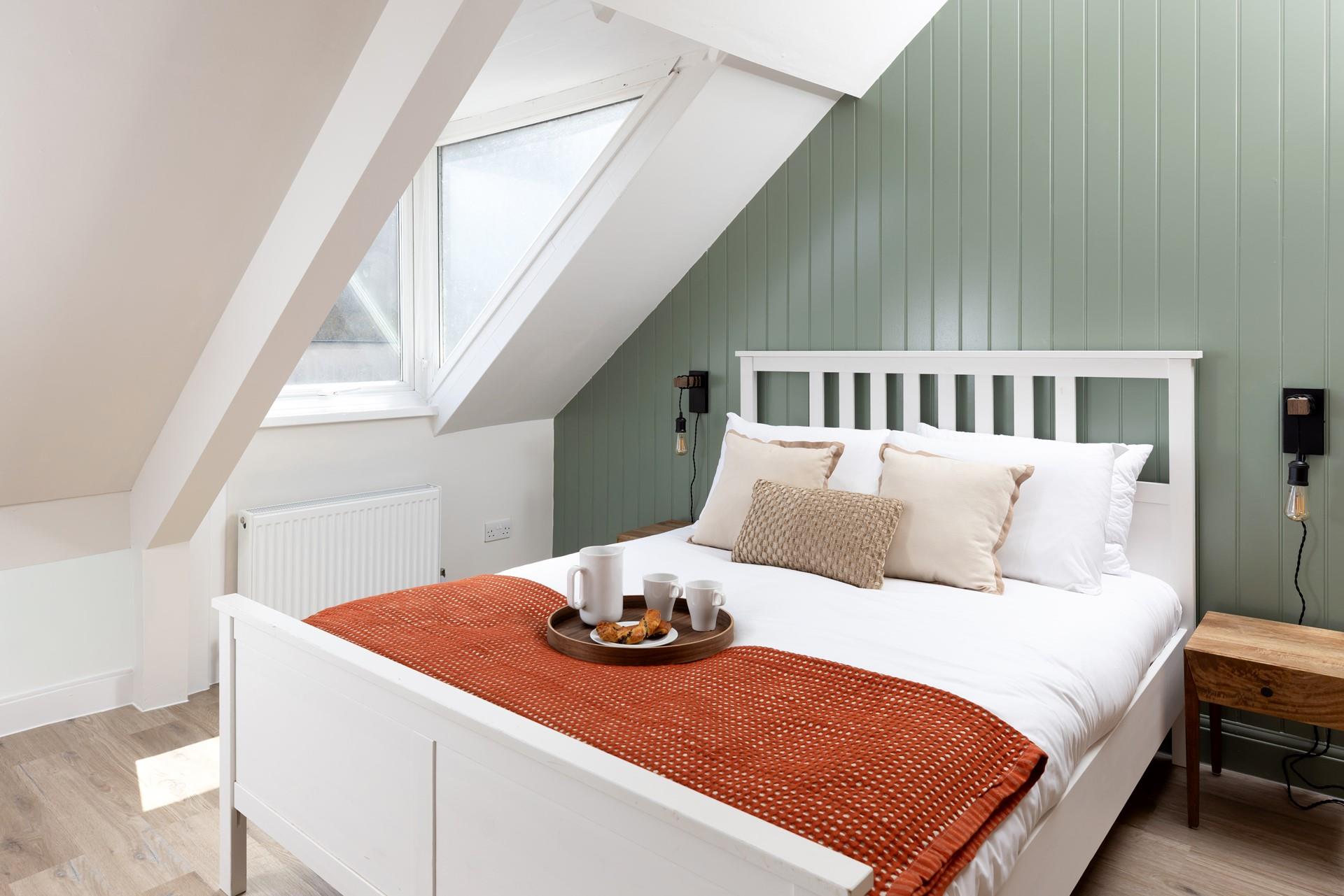 Bedroom 1 has a boutique feel.