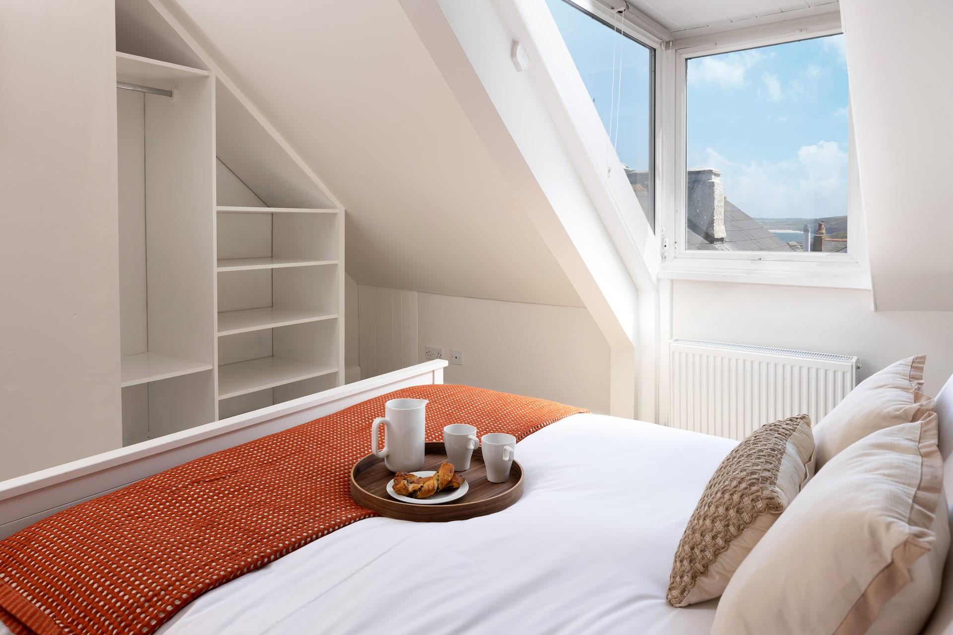 Gaze across the rooftops to the sea beyond!