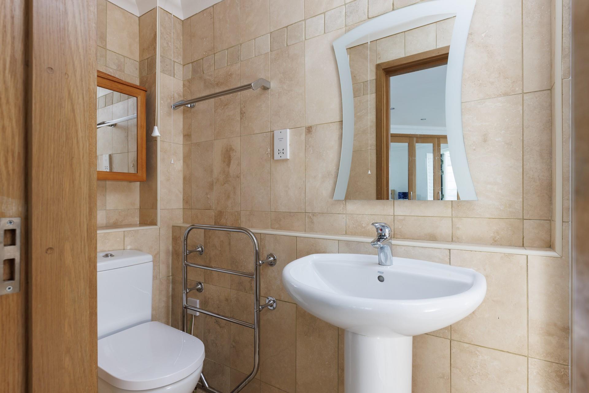 Get ready for the day in the spacious bathroom.