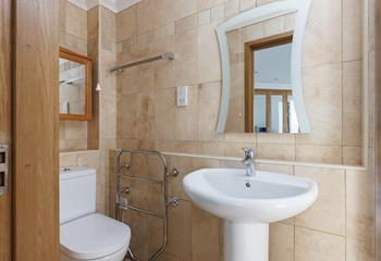 Get ready for the day in the spacious bathroom.