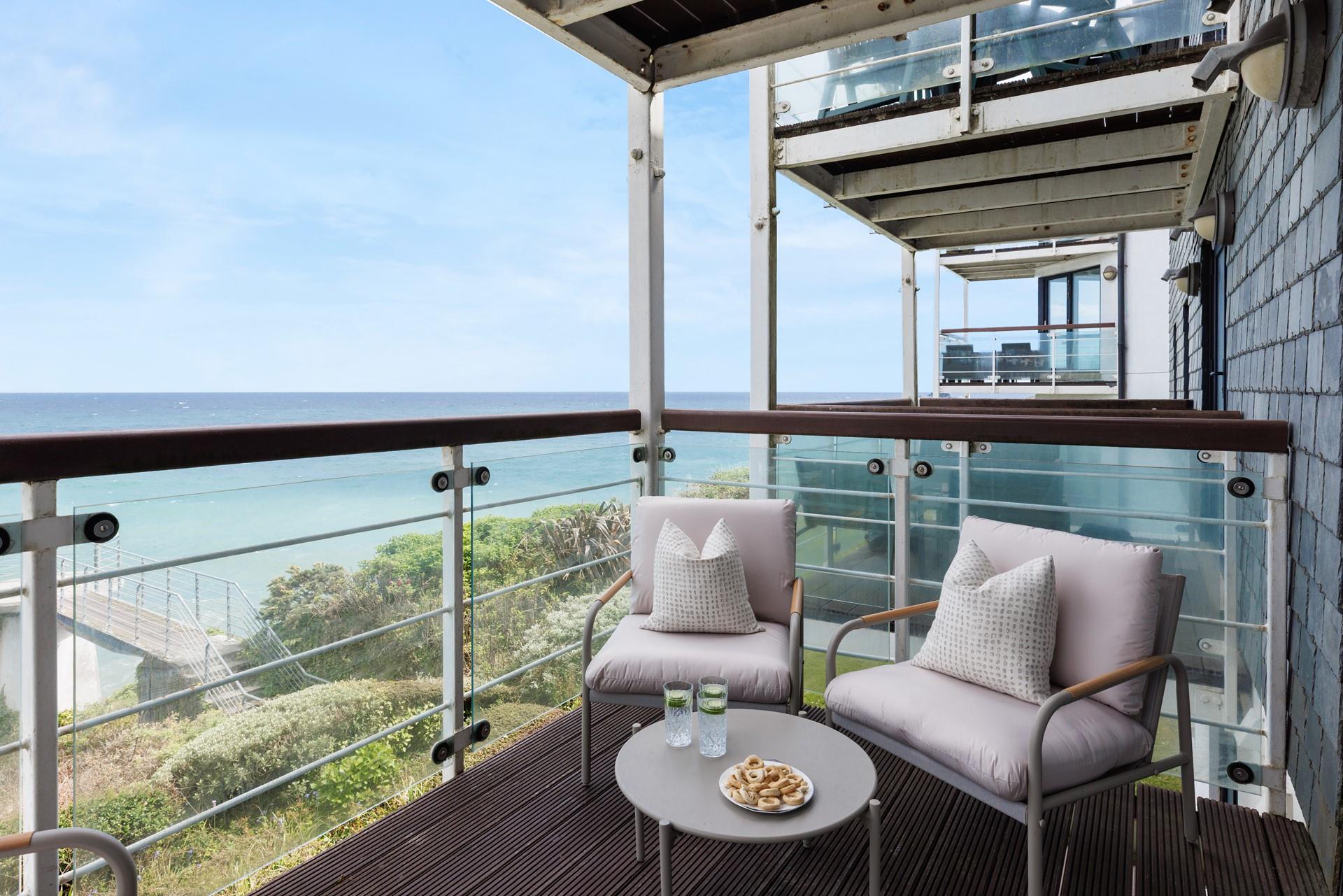 Take drinks and nibbles onto the balcony and enjoy the sea views.