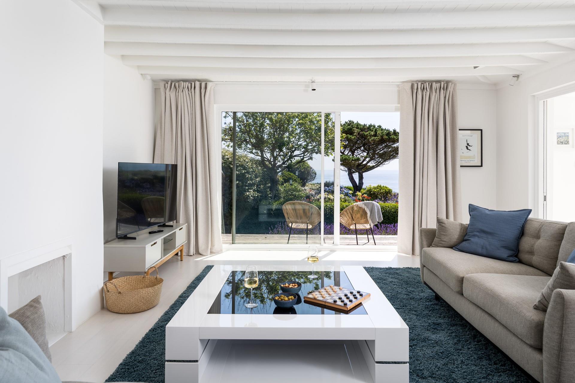 Coastal blues adorn the spacious living area.