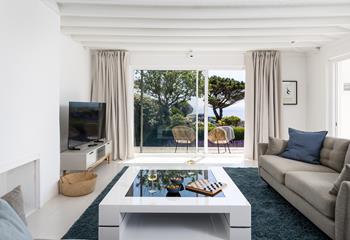 Coastal blues adorn the spacious living area.