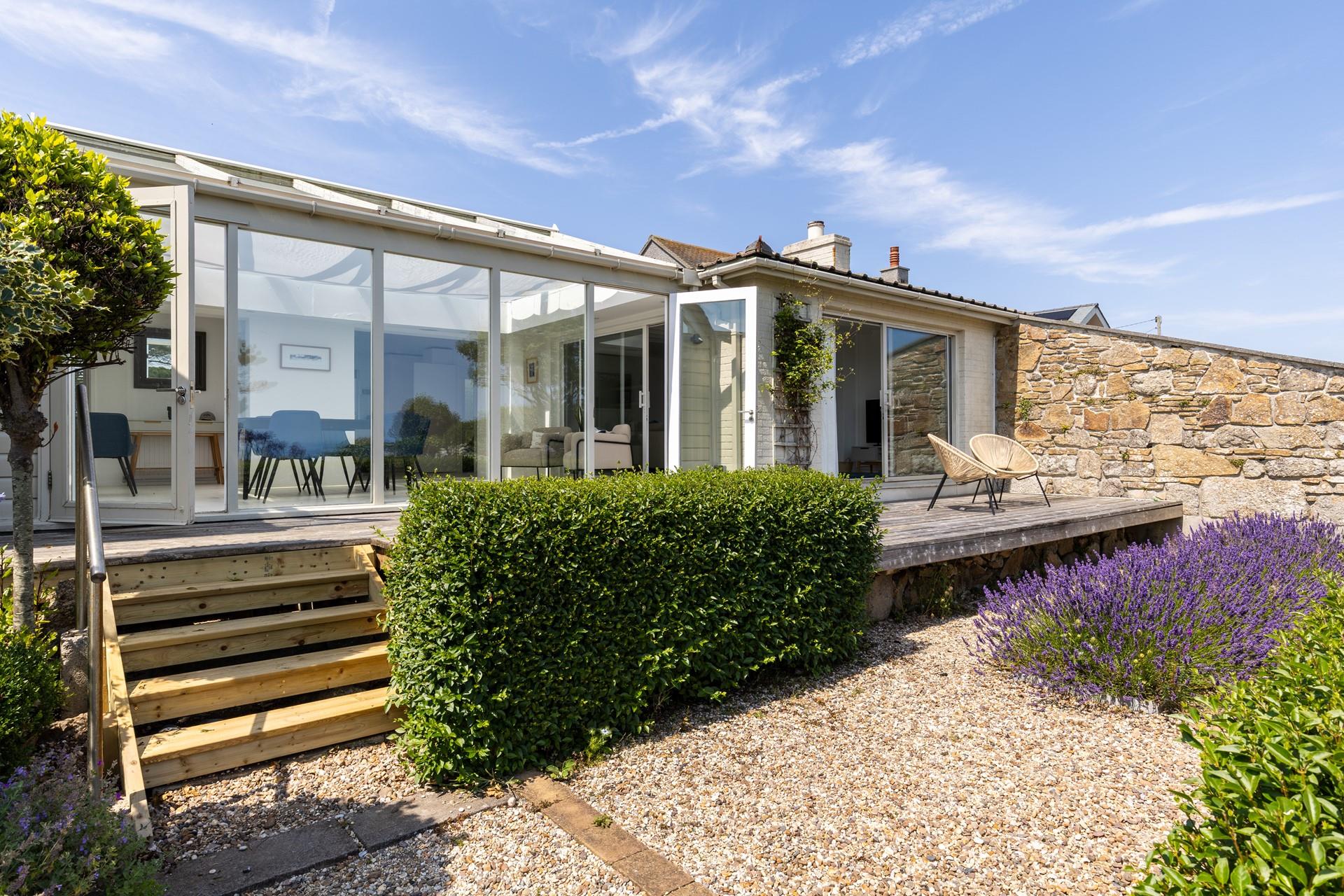 The deck runs along the back of the house, giving you plenty of spots to take in the view.