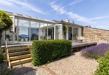 The deck runs along the back of the house, giving you plenty of spots to take in the view.