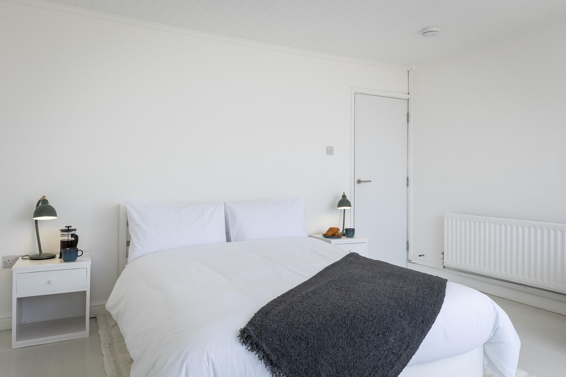 Crisp white bedding awaits you at Anchor Watch.