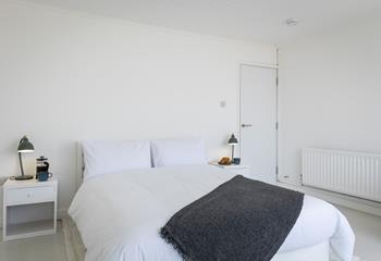 Crisp white bedding awaits you at Anchor Watch.