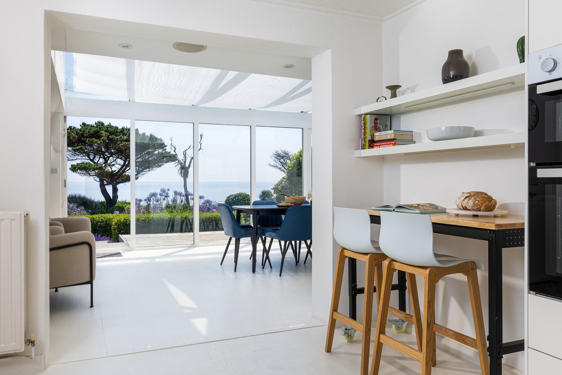 Open plan kitchen and dining makes the most of the view.
