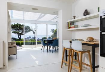 Open plan kitchen and dining makes the most of the view.