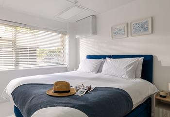 The stylish coastal blues create a relaxing haven in bedroom 3.