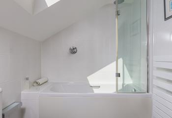 The family bathroom has a rainfall shower over bath.