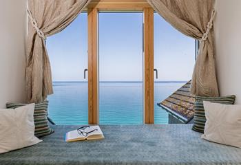 While away the hours curled up in the window seat watching the everchanging tide.