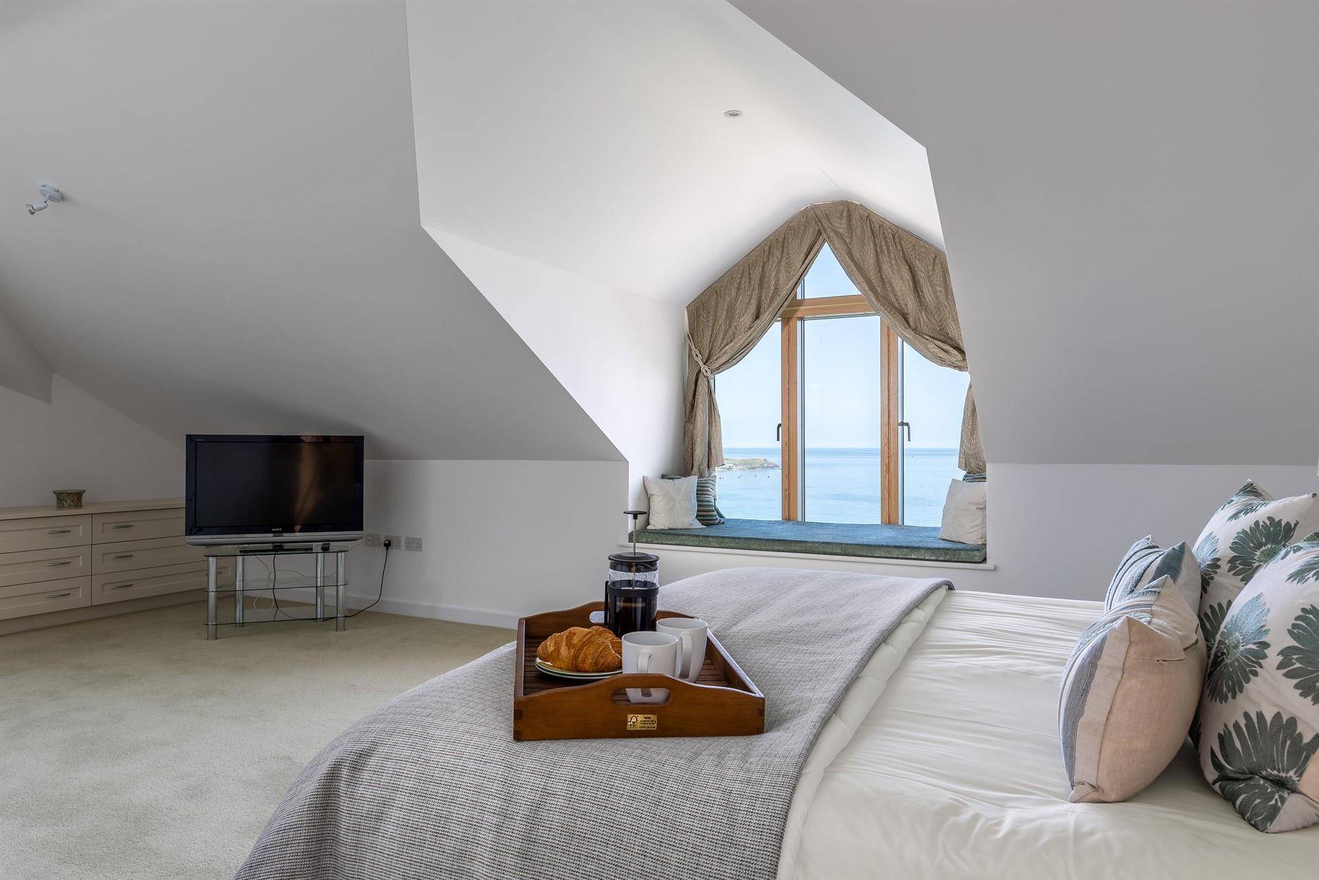 Wake up to stunning views from bedroom 1, sipping your morning coffee as fishing boats sail by.