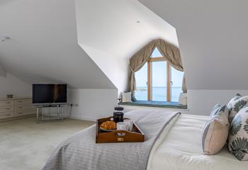 Wake up to stunning views from bedroom 1, sipping your morning coffee as fishing boats sail by.