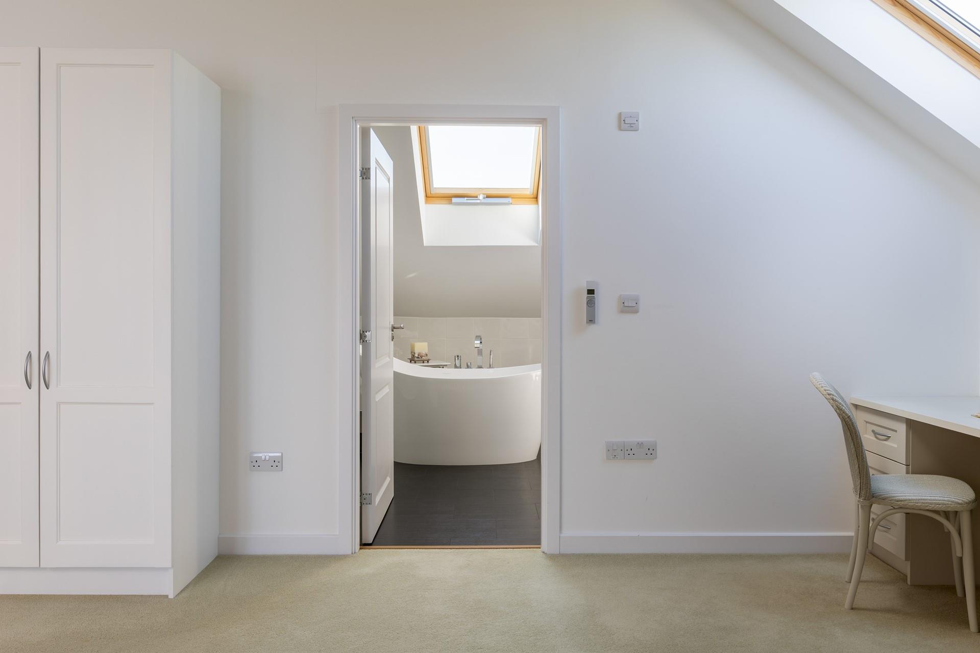 Bedroom 3 boasts an en suite with a luxurious slipper bath.