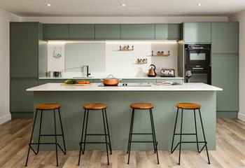 The stylish kitchen is designed for cooking and socialising.