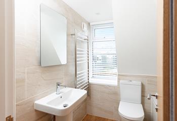 Even the second floor bathroom offers sea glimpses.