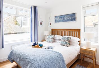 Coastal decor adorns bedroom 3.