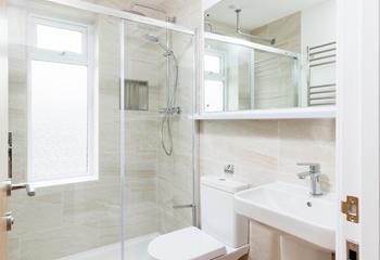 There's an additional bathroom with a spacious walk-in rainfall shower.