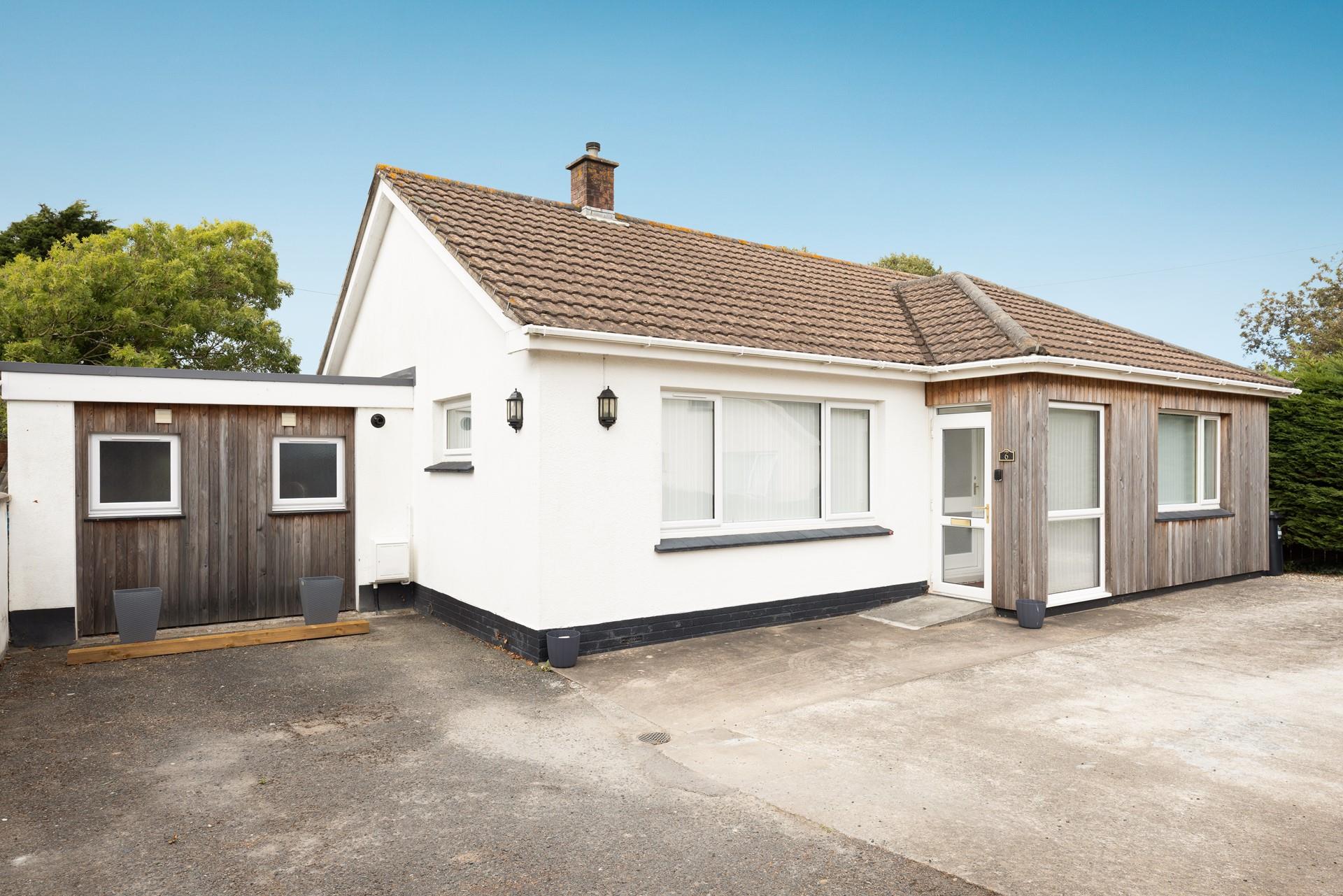 Arrive with ease, as there's ample parking for two cars on the driveway.