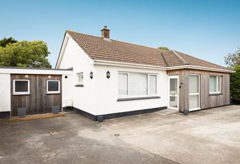 Arrive with ease, as there's ample parking for two cars on the driveway.
