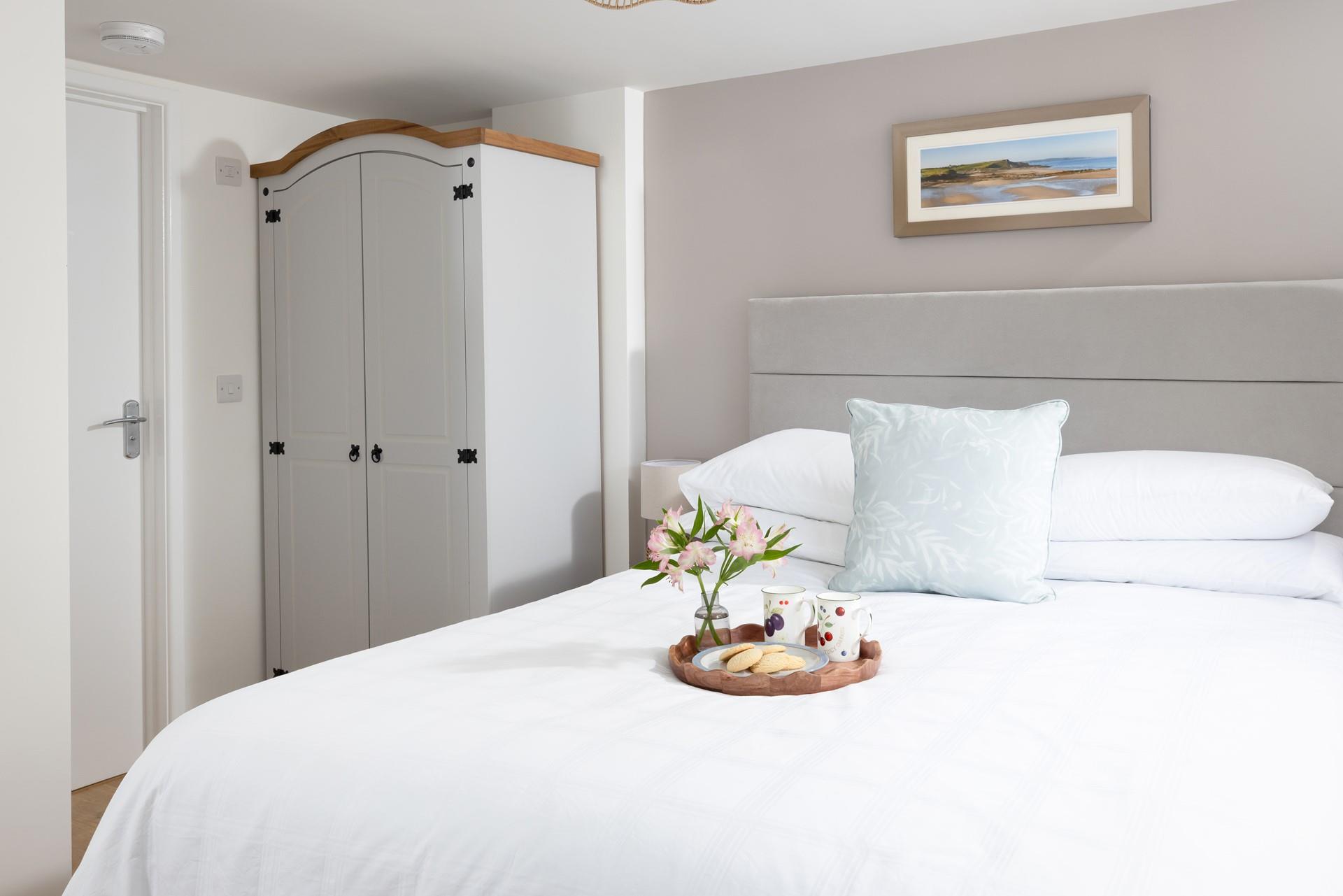 Bedroom 1 has a sumptuous king size bed, and plenty of storage.
