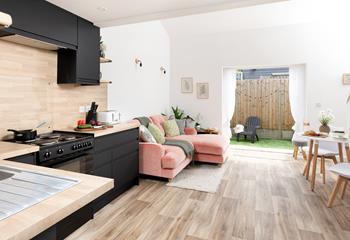 The modern living area has all you need for a relaxing stay.