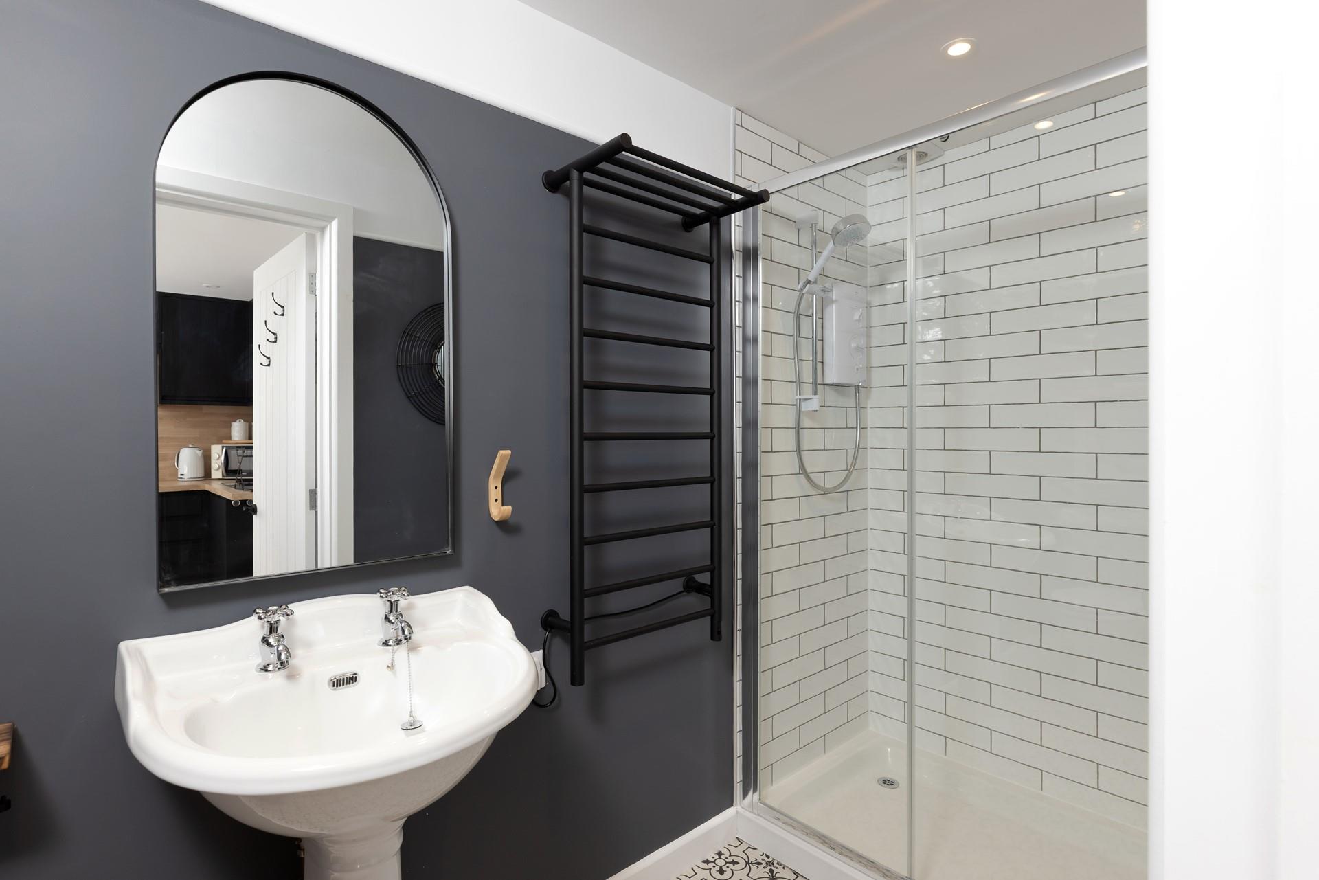 Step into the spacious walk in shower!