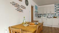 Open plan living includes a kitchen and dining area.