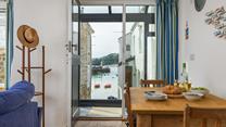 Enjoy quaint views of boats bobbing as the tide ebbs and flows.