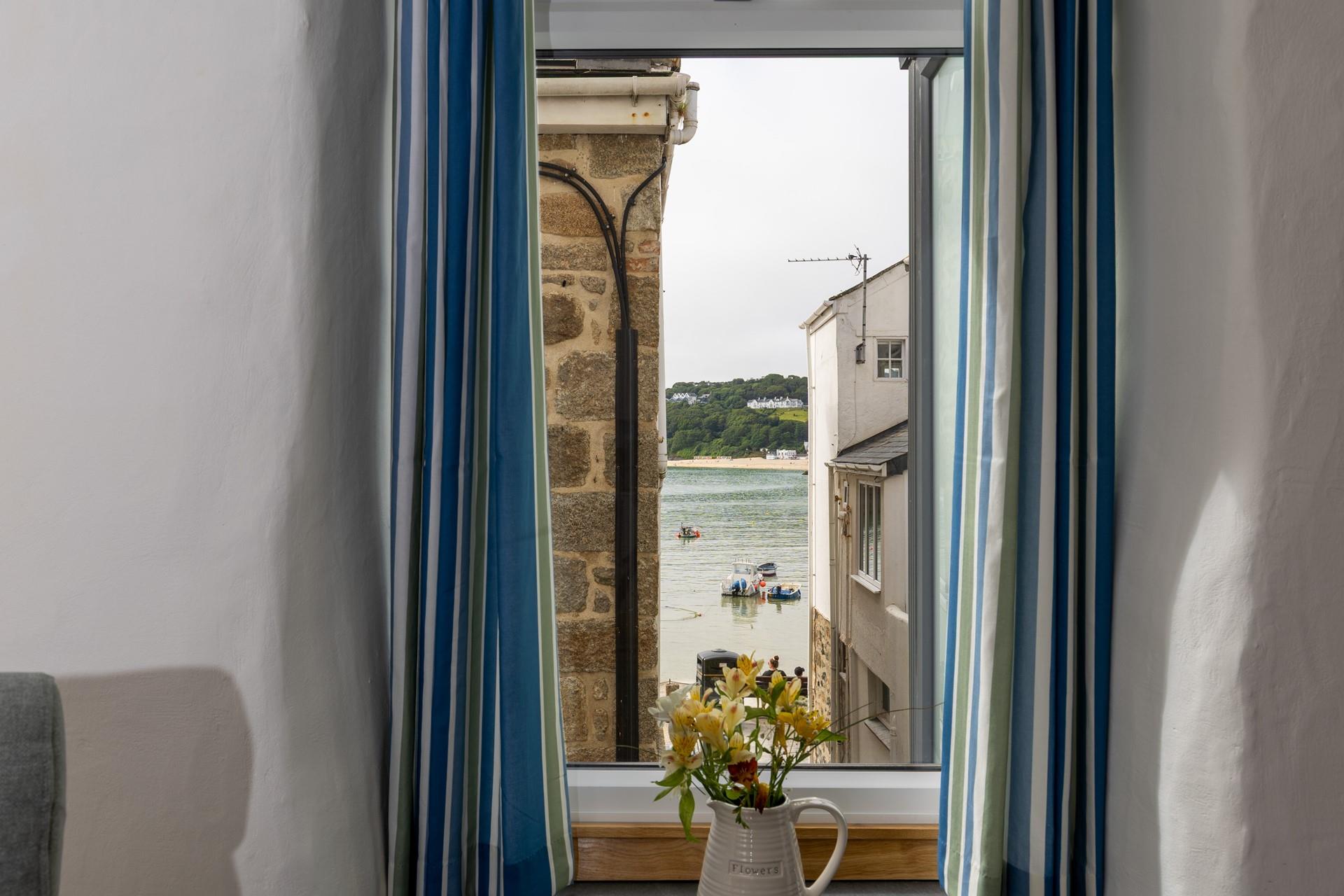 Gaze across the harbour to the ever-changing view.